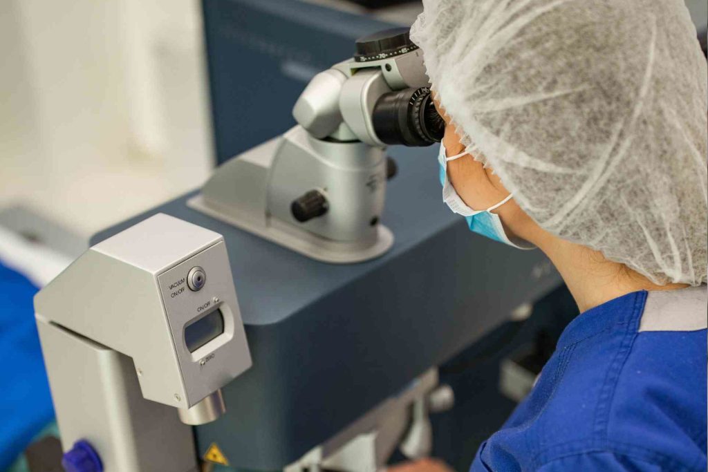 Surgeon performing LASIK eye surgery on a patient