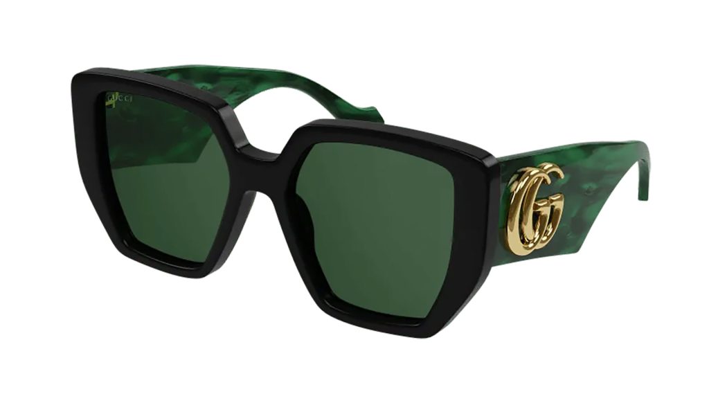 Gucci GG0956S women’s sunglasses featuring green and black frames, tinted lenses and a gold logo