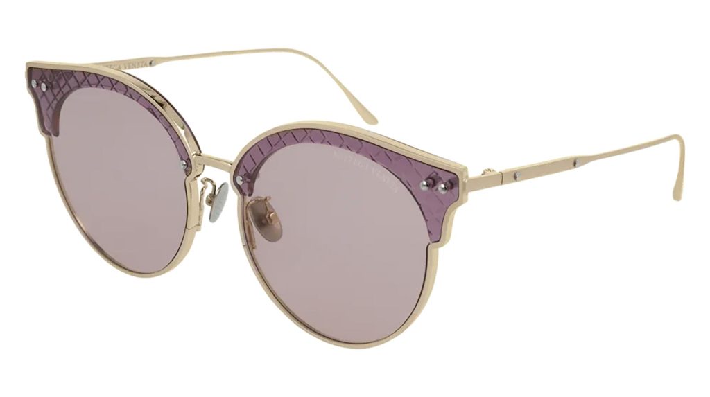 Round Bottega Veneta BV0210S sunglasses featuring gold frames and pink lenses
