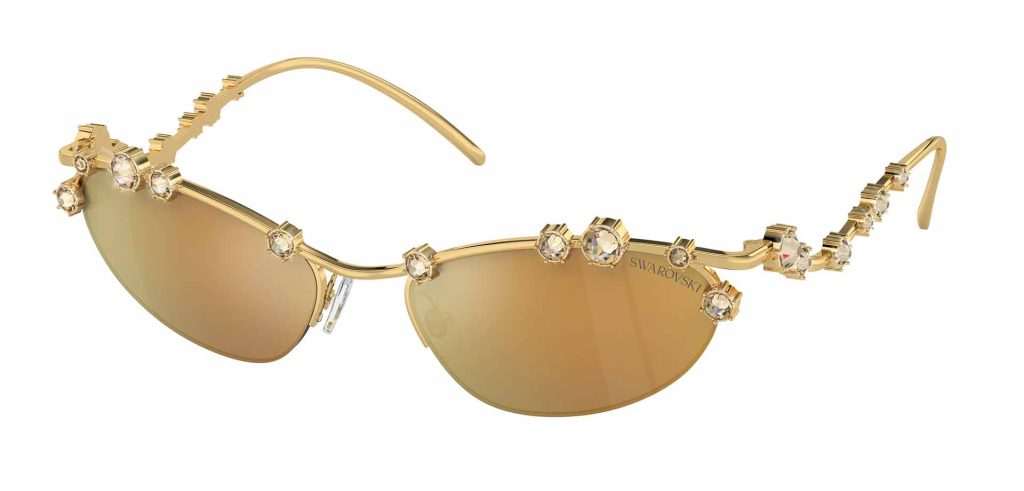 Glamorous gold Swarovski SK7016 cat-eye sunglasses featuring floral details and mirror gold lenses